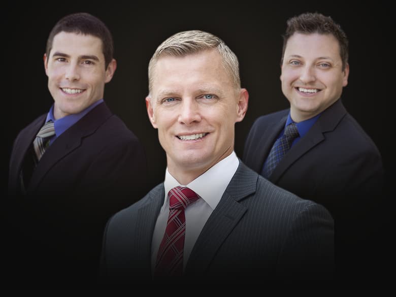 Kent Law attorneys Adam Kent, center, with Andrew Shaver and Jonathan Henry